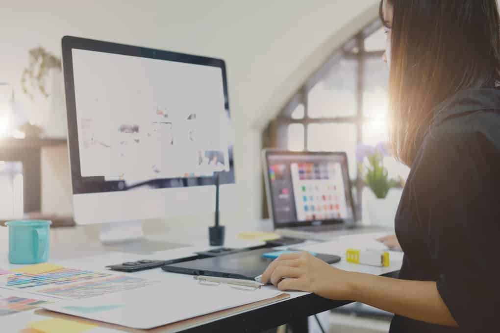 graphic designer creating effective infographics