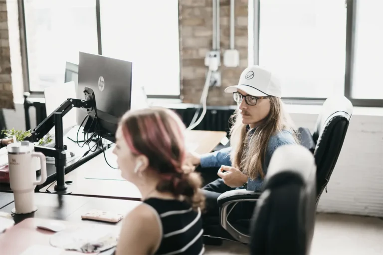 Dylan, a Sr. SEO Specialist at Hook Agency, discussing SEO strategies with Alaska, a Jr. SEO Specialist, highlighting the agency's commitment to continuous improvement through the Kaizen philosophy. This mindset of incremental, daily progress has made a significant impact on the quality of services delivered to Hook Agency’s home service clients, ensuring cutting-edge SEO techniques and consistent, measurable results. The team’s Kaizen-driven approach sets Hook Agency apart as a leader in home services marketing, continually refining their strategies to better serve HVAC, roofing, and plumbing businesses.